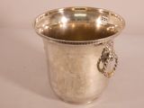 a silver cup that is sitting on a table