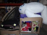 a large white teddy bear sitting on top of a cardboard box