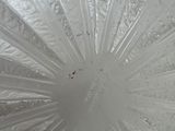 a close up view of a frosted glass umbrella