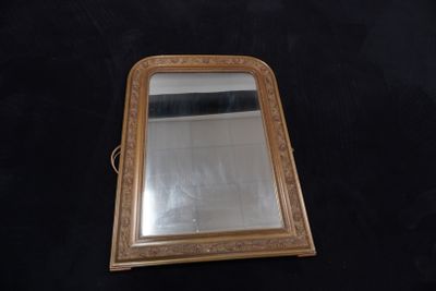 a mirror that is sitting on a black surface