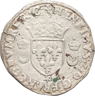 an old silver coin with a crown on top of it