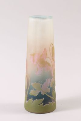a tall vase with a floral design on it