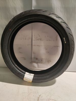 a close up of a tire tire on a white surface