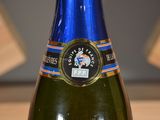 a close up of a bottle of wine on a table