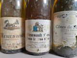 several bottles of wine are lined up on a table