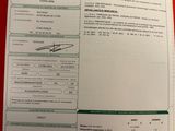 une photo d'un document sur lequel figure la photo d'une personne
