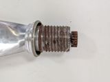 a metal object that has been placed on a white surface