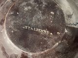 a dirty plate sitting on top of a table