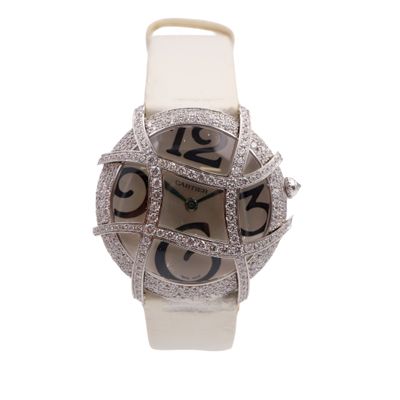 an image of a close up of a watch on a white surface
