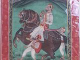 painting of a man riding a horse with a woman on the back