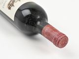 a bottle of wine that is sitting on a table