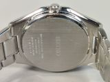 an image of a close up of a watch on a white surface