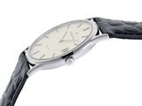 a watch that is sitting on a black leather strap