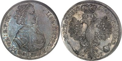 a close up of two silver coins on a white background
