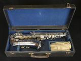 a saxophone that is in a case on a table