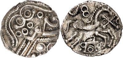 a silver coin with an image of a man on it