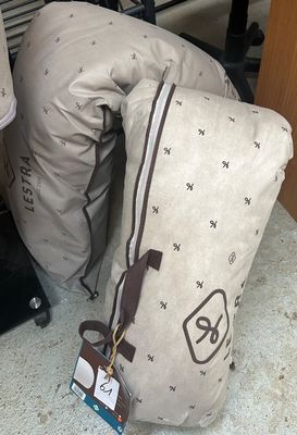 a pile of luggage sitting on the floor next to a chair