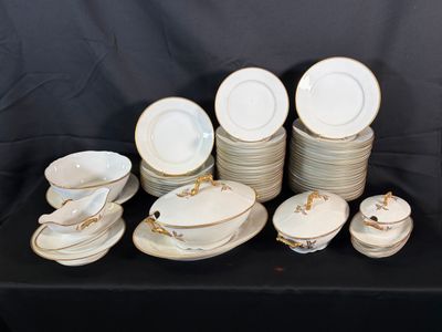 a lot of plates and bowls on a table