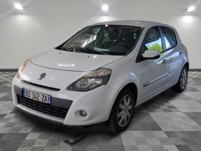 a picture of a small white car parked in a garage