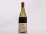 a bottle of wine that is sitting on a table