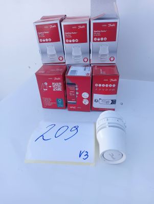 several boxes of electronic gadgets are sitting on a table next to a notepad