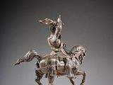 statue of a man on a horse with a bird in his hand