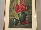 une photo d'un tableau représentant des fleurs dans un vase, posé sur un chevalet