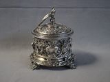 a silver box with a bird on top of it