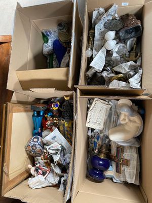 two boxes with items in them sitting on the floor