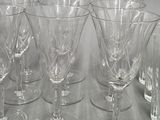 six wine glasses sitting on a table next to each other