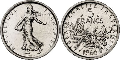 a close up of a coin with a drawing of a woman on it