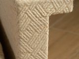 a close up of a couch with a pillow on top of it