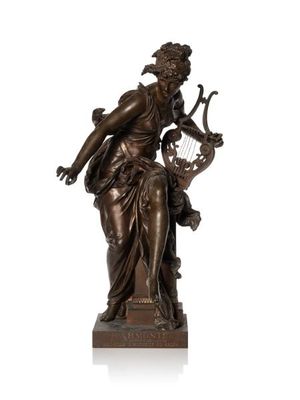 a bronze statue of a woman holding a harp