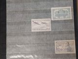 a lot of different stamps on a book on a table