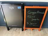 a chalk board next to a chalk board with writing on it