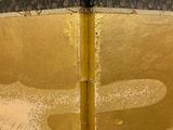 a close up picture of a book with gold foil on it