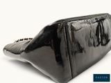an image of a black purse on a white background