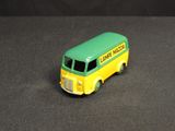 a toy bus that is sitting on a black surface