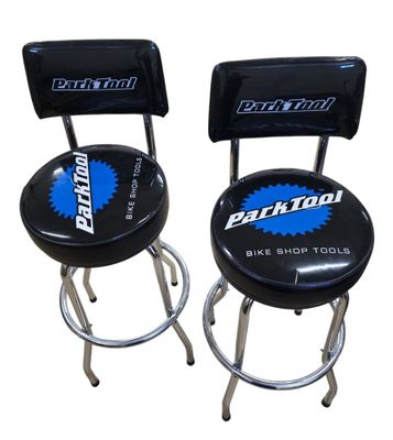pair of black bar stools with blue logo on them