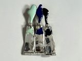 a picture of a silver and blue object on a white surface