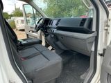 the interior of a white van with the door open and the driver ' s seat down
