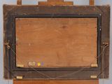 an old wooden easel with a painting on top of it