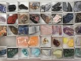 a box full of different colored rocks and stones