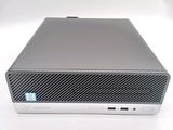 the front of a silver computer with a blue sticker on it ' s side