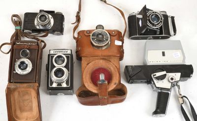 many different types of cameras on a white surface