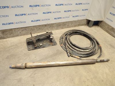 an image of a pipe and a hose on the floor