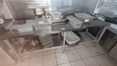 a kitchen with a lot of counter space and a lot of appliances