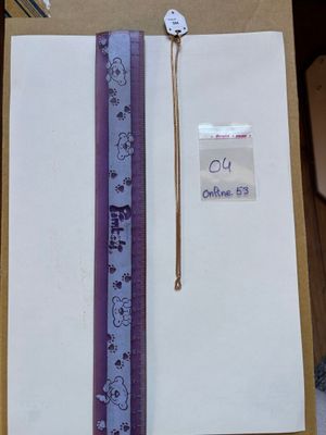 a picture of a notepad with a pen and a ruler on it