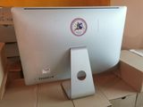 a computer monitor sitting on top of a cardboard box