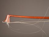 a close up of a wooden stick with a string attached to it